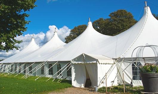 a line of sleek and modern portable toilets ready for use at an upscale corporate event in Spotswood